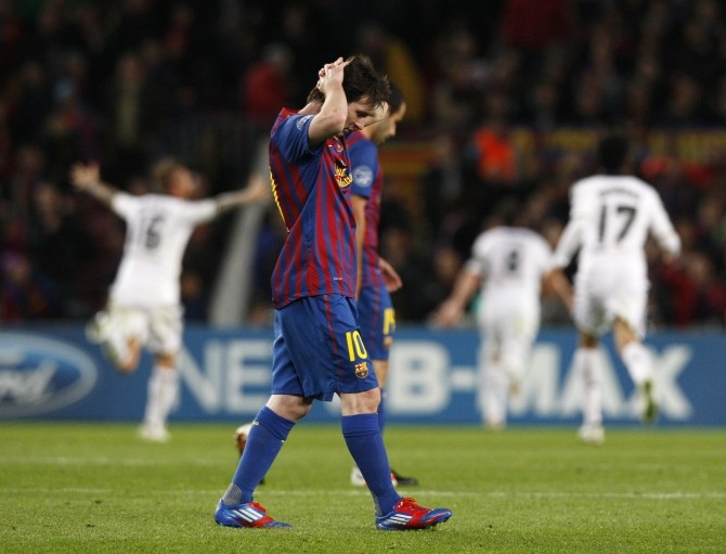 Barcelona's Messi reacts after Chelsea's second goal during their Champions League soccer semi-final in Barcelona