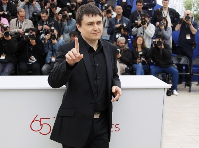 Director Mungiu attends a photo call for the film Dupa Dealuri at the 65th Cannes Film Festival