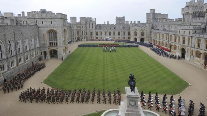 British armed forces personnel march during Queen Elizabeth's Diamond Jubilee Parade and Muster in Windsor
