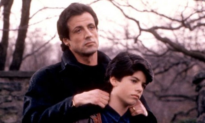 A young Sage Stallone with his father in Rocky V (1990).