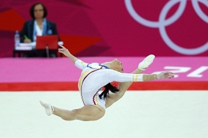 Catalina Ponor of Romania competes in the floor exercise during the women's gymnastics qualification in London