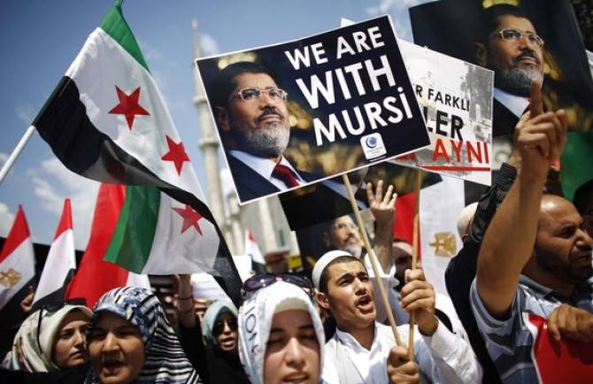 Protesters shout slogans in support of deposed Egyptian President Mursi during a pro-Islamist demonstration in Istanbul